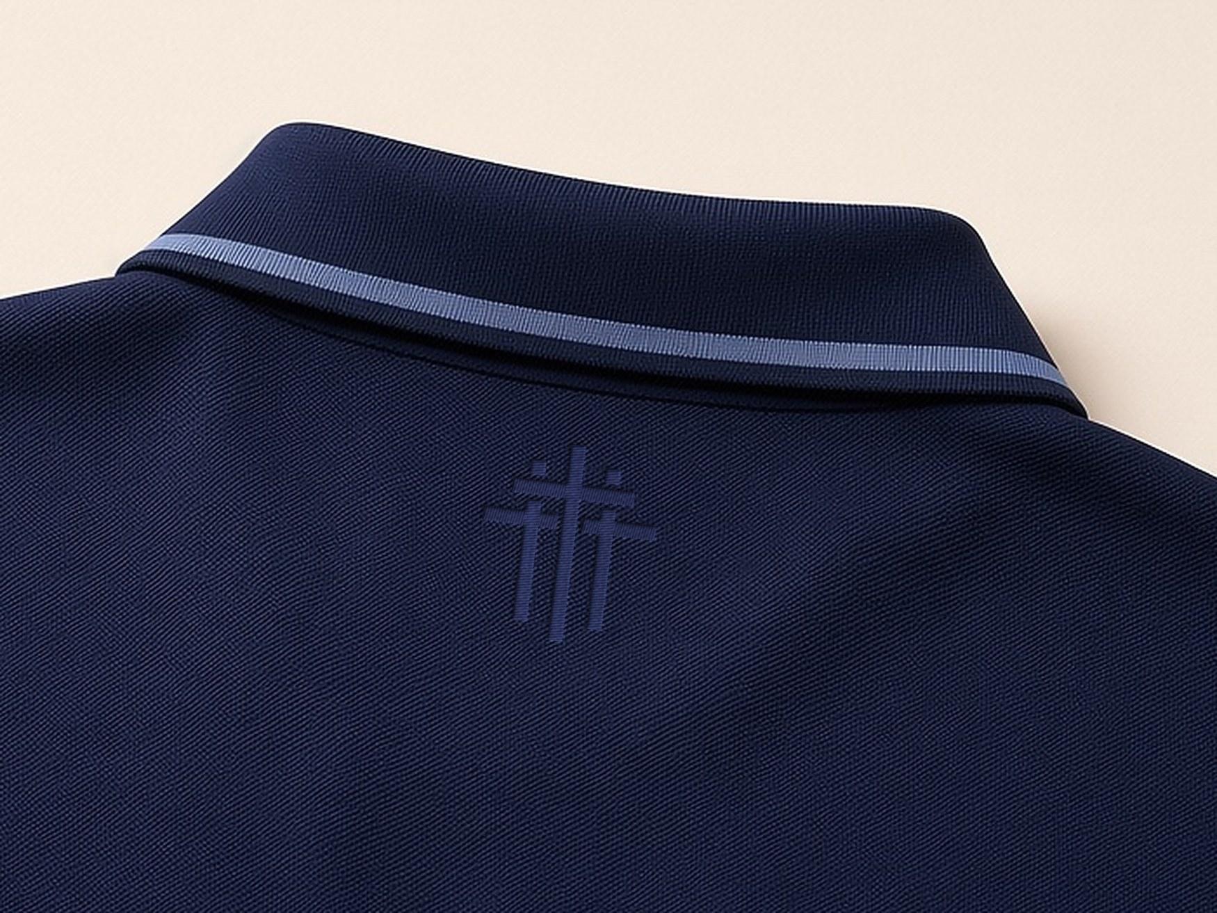 Small tone-on-tone three-cross just below the back collar