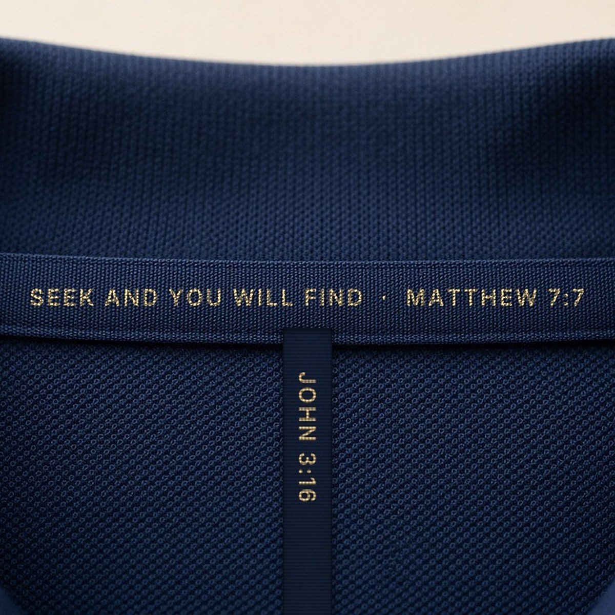 Inside the collar, a cross of tapes: Matthew 7:7 across, John 3:16 hanging down